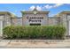 Community entrance sign for Carriage Pointe, with stone accents, set in well-maintained landscaping at 8105 Bilston Village Ln, Gibsonton, FL 33534