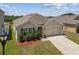 Well-maintained single-Gathering home featuring a two-car garage, landscaped yard, and neutral color palette at 8105 Bilston Village Ln, Gibsonton, FL 33534