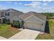 Charming single-Gathering home with a well-manicured front yard, two-car garage, and coordinated exterior colors at 8105 Bilston Village Ln, Gibsonton, FL 33534