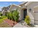 Exterior featuring a tidy yard leading up to the front door at 8105 Bilston Village Ln, Gibsonton, FL 33534