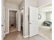 Hallway featuring a view of the closet, bathroom and bedroom at 8105 Bilston Village Ln, Gibsonton, FL 33534