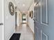 Hallway featuring neutral paint, tile flooring, and modern decor at 8105 Bilston Village Ln, Gibsonton, FL 33534