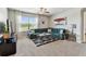 Living room features natural light, neutral walls and flooring, and a modern ceiling fan at 8105 Bilston Village Ln, Gibsonton, FL 33534