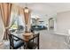 Open concept floor plan from dining area to the living room with patio access at 8105 Bilston Village Ln, Gibsonton, FL 33534