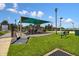 A community playground with benches, green spaces, a covered play structure, and room to play at 8105 Bilston Village Ln, Gibsonton, FL 33534