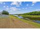 Lush green pond and grassy yard at 8105 Bilston Village Ln, Gibsonton, FL 33534
