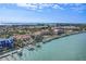 Stunning aerial shot featuring residences with private docks and access to beautiful bay waters at 936 Pinellas Bayway S # T-5, Tierra Verde, FL 33715