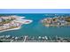 Stunning aerial view of beachfront property with boat docks and picturesque coastal scenery at 936 Pinellas Bayway S # T-5, Tierra Verde, FL 33715