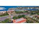 Nice aerial perspective of a coastal neighborhood with verdant foliage, streetscapes, and waterfront amenities at 936 Pinellas Bayway S # T-5, Tierra Verde, FL 33715