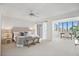 Spacious bedroom with a connected sitting area and views of the bay from the desk at 936 Pinellas Bayway S # T-5, Tierra Verde, FL 33715