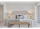 Bright bedroom featuring a plush bed with decorative pillows and a cozy throw blanket at 936 Pinellas Bayway S # T-5, Tierra Verde, FL 33715