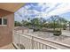Spacious paved driveway and garage with lush landscaping and palm trees view from a balcony at 936 Pinellas Bayway S # T-5, Tierra Verde, FL 33715