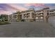Multi-level condo complex showcasing private balconies, covered parking, and well-maintained landscaping at 936 Pinellas Bayway S # T-5, Tierra Verde, FL 33715