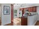 Modern kitchen featuring stainless steel appliances and sleek wood cabinetry at 936 Pinellas Bayway S # T-5, Tierra Verde, FL 33715