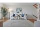 Cozy living room with a plush sofa, stylish decor, and wood flooring at 936 Pinellas Bayway S # T-5, Tierra Verde, FL 33715