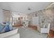 Bright living room boasts wood floors, marble accents, and an open staircase at 936 Pinellas Bayway S # T-5, Tierra Verde, FL 33715