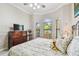 Comfortable bedroom featuring a wooden dresser and bay windows for natural light at 9611 125Th N St, Seminole, FL 33772