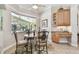 Breakfast nook with outdoor pool view, cabinetry, and desk area, perfect for a casual dining experience at 9611 125Th N St, Seminole, FL 33772