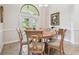 Cozy dining room featuring a round table, comfortable chairs, and access to the patio at 9611 125Th N St, Seminole, FL 33772