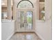 Elegant foyer featuring decorative glass doors and a beautiful tile floor design at 9611 125Th N St, Seminole, FL 33772