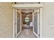 Welcoming foyer with decorative glass doors opening to a cozy living space at 9611 125Th N St, Seminole, FL 33772