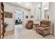 Welcoming foyer with decorative arches, access to the office, and comfortable seating area at 9611 125Th N St, Seminole, FL 33772