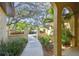 Inviting walkway with manicured landscape leading to the front door at 9611 125Th N St, Seminole, FL 33772