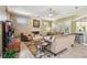 Bright living room featuring a fireplace, comfortable seating, and views of the outdoor area at 9611 125Th N St, Seminole, FL 33772