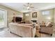 Cozy living room features a fireplace, plush seating, neutral tones, and natural lighting at 9611 125Th N St, Seminole, FL 33772