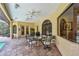 Covered patio with tile flooring, ceiling fans, outdoor furniture and a view of the screened pool at 9611 125Th N St, Seminole, FL 33772
