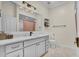 Bright bathroom features a double vanity, large mirror, and modern fixtures at 10101 Bryant Rd, Lithia, FL 33547