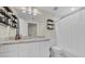 Cozy bathroom offering a single vanity, shower and tub combo, and extra shelving for storage at 10101 Bryant Rd, Lithia, FL 33547