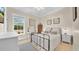 Comfortable bedroom with a metal bed frame, soft decor, and ample natural light at 10101 Bryant Rd, Lithia, FL 33547
