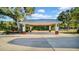 Wide carport featuring sturdy posts and a metal roof to protect vehicles from the elements at 10101 Bryant Rd, Lithia, FL 33547