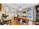 Elegant dining room with hardwood floors, classic chandelier, and bright windows with picturesque views at 10101 Bryant Rd, Lithia, FL 33547