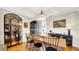 Elegant dining room with hardwood floors, modern lighting, and stylish display cabinets at 10101 Bryant Rd, Lithia, FL 33547