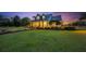 Charming home with manicured lawn and twilight sky at 10101 Bryant Rd, Lithia, FL 33547