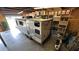 Spacious garage featuring a full sized LANCE camper offering ample room for storage and recreational vehicles at 10101 Bryant Rd, Lithia, FL 33547