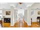 Spacious hallway with hardwood floors, white trim, and recessed lighting throughout at 10101 Bryant Rd, Lithia, FL 33547