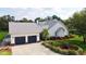 Beautiful home with a well-kept lawn, grey roof, and ample driveway parking at 10101 Bryant Rd, Lithia, FL 33547