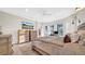 Serene primary bedroom with hardwood floors, natural light, and a cozy sitting area at 10101 Bryant Rd, Lithia, FL 33547