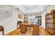 Charming office featuring a beautiful wood desk, hardwood floors, and built-in shelves at 10101 Bryant Rd, Lithia, FL 33547