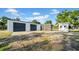 Functional outbuilding with roll-up doors and a convenient screened-in porch, offering versatile space at 10101 Bryant Rd, Lithia, FL 33547