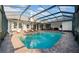 Private pool with brick surround and screened enclosure for year-round enjoyment at 10101 Bryant Rd, Lithia, FL 33547