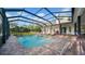 A stunning, screened-in pool with brick patio is the focal point of this beautiful home at 10101 Bryant Rd, Lithia, FL 33547
