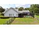 Spacious backyard features a pool, screened enclosure, and well-maintained landscaping at 10101 Bryant Rd, Lithia, FL 33547