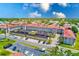 Spacious building with lush landscaping, covered parking and mature palms at 10215 Regal Dr # 41, Largo, FL 33774