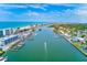 Panoramic aerial view of a coastal community, featuring waterfront properties, canals, and beach access at 10215 Regal Dr # 41, Largo, FL 33774