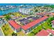 Beautiful coastal community with a red tile roof, lush greenery and nearby ocean views at 10215 Regal Dr # 41, Largo, FL 33774