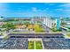 Aerial view of a condo complex, covered parking, and surrounding landscape near the waterfront at 10215 Regal Dr # 41, Largo, FL 33774